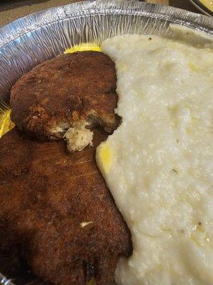 Salmon cakes, grits and eggs.