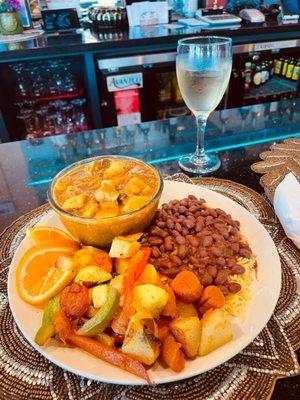 Curry Goat, rice and peas and vegetables