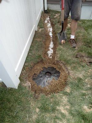 Solution install drywell, to collect and redistribute water into the ground.