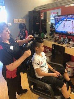 This young man wanted a haircut to match his favorite baller- he left with a cool cut and a big smile!