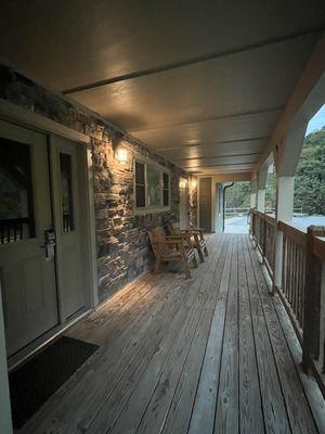 Front porch (door on left is main entry into cabin; the other door is one of the private bedroom doors)