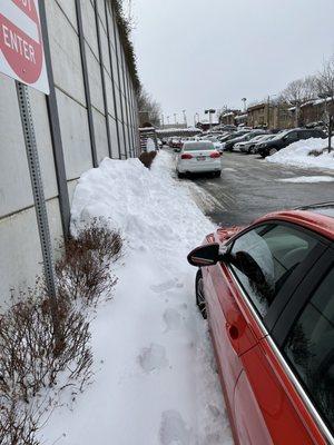 This is the 8" of accumulation next to a wall where they pinned me in. I had to trudge through a foot of embalmed snow.