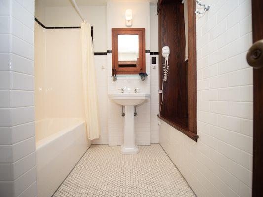 White tile bathrooms.