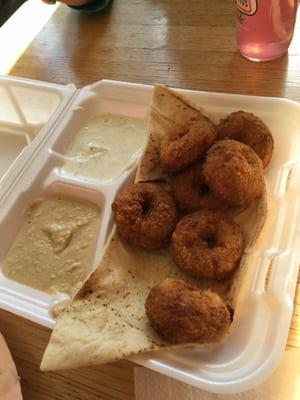 Falafel and pita bread with yogurt dill sauce and hummus