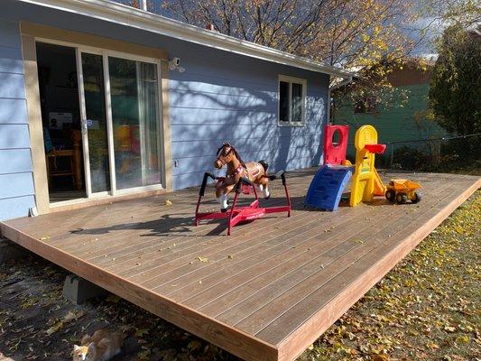 Backyard deck with trim, new trim around our door, new porchlight installed, and new outlets.  Beautiful!