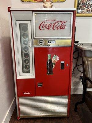 They offer free beer/soda with your cut out if this amazing vintage glass Coke machine!