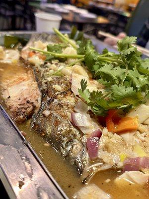 Striped bass with lotus roots, bean curd, and potatoes.