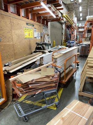 The lumber yard is a mess. Carts and pieces everywhere unattended. It's hard to walk through let alone find anything