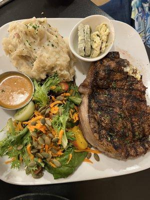 Ribeye crusted in espresso with both the blue cheese and jalapeño butter in the side. Delicious!