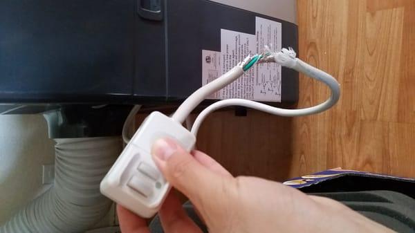 This was the damage my rabbit did on the portable AC power cord. (Before fix)