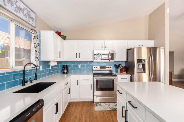 The after - backsplash and flooring came from Floor and Decor