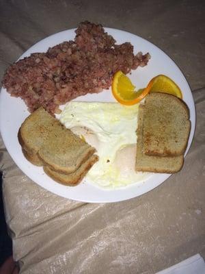 Corn beef hash with over easy eggs.