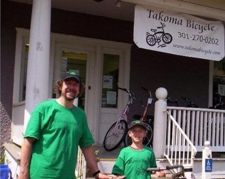 Bruce Sawtelle with son Nathan, 11 in front of their store