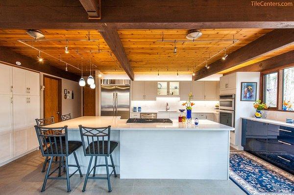 modern blue and white kitchen with l shape island. design and installed by Tile Center