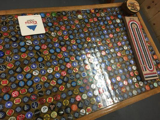 Closeup of bottle cap table