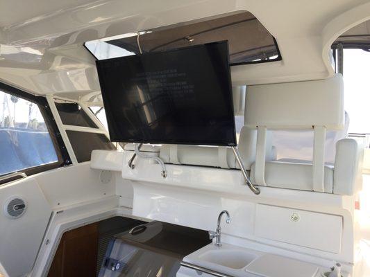 Custom cockpit TV install on a SIlverton 36 aft cabin.