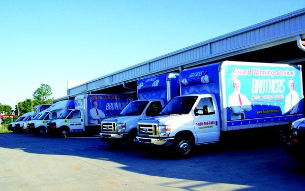 BROTHERS Install trucks getting ready to roll.