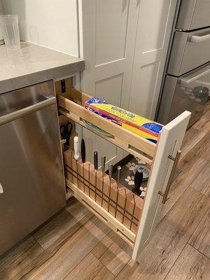 We converted the 6" spice cabinet into a knife cabinet with a custom-made knife block.  It's perfect!