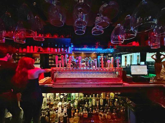 Shot of the beer taps and bar scene at Busby"s