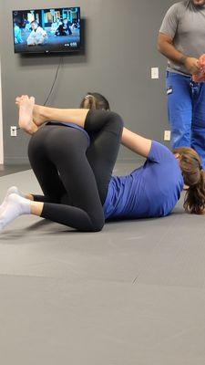 My colleague opening up her guard in Jujitsu