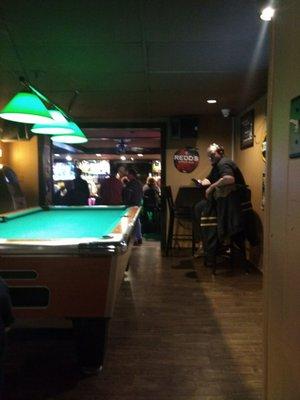 Pool table looking into the bar.