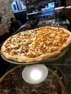 Our best selling Cajun Chicken pizza (left)