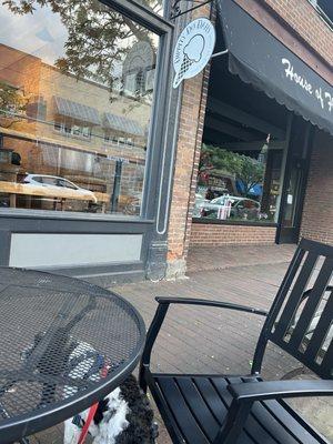 Bench and table on sidewalk allows dogs