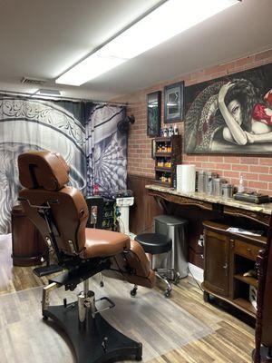 Shop owner Mike's tattoo booth