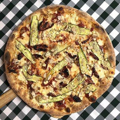 Rotating Pizza Lab: "Zucchini Zest"

Red sauce base with aged mozz, sumac-spiced zucchini and chicken, sun dried tomatoes, sliced almonds