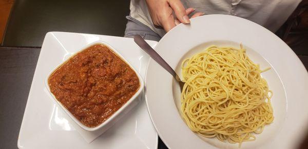 Spaghetti and meat sauce. My sister always orders the sauce on the side.