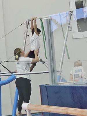 Coach Ana helping my son do pull ups.