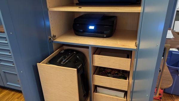 Pullout for paper shredder and space for hidden printer.