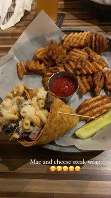 Mac and cheese steak wrap with waffle fries