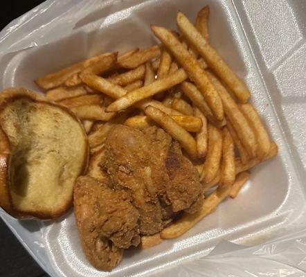 Chicken wing sandwich and fries