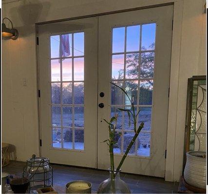 One set of the 14 light French doors has been installed into cottage #1 so you can view the sunset from the sitting area. Fabulous.