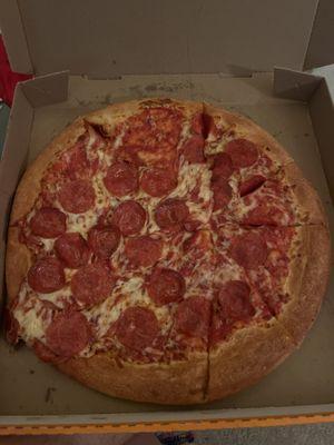 This is the pizza we got it isn't even cut and it looks like it's been sitting all day this is disgusting.