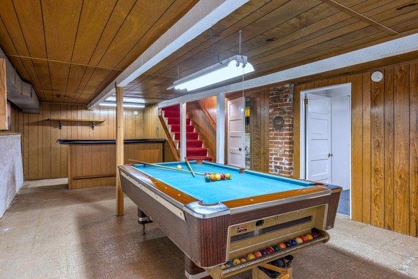 Cool downstairs basement with pool table & bar.