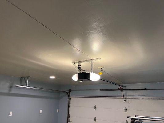 New Genie 3120HL garage door. The technician also reattached the garage door rails to the new ceiling as part of the installation.