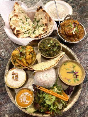 Garlic naan, Himalayan fish curry. Vegetarian combo plate  -  YUM!!! will definitely go back again  (11/2023)