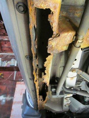 Rust on the unibody frame 3 feet long left hand side