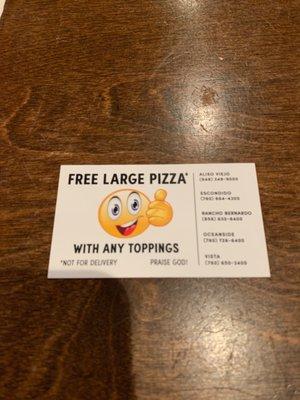 FREE LARGE PIZZA WITH ANY TOPPINGS. Travis the store manager gave me this card.