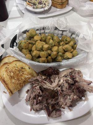 Pulled pork, fried okra, and garlic bread.