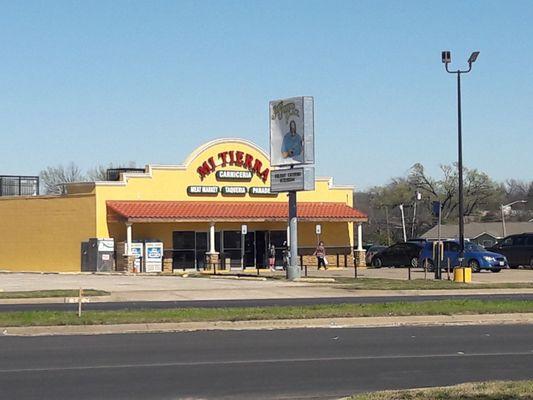 The store and it's parking lot from the street