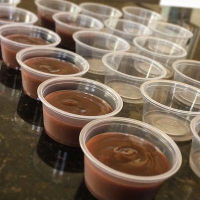 Some of our "scratch" BBQ sauce. Getting them ready and lined up for our togo/take out event