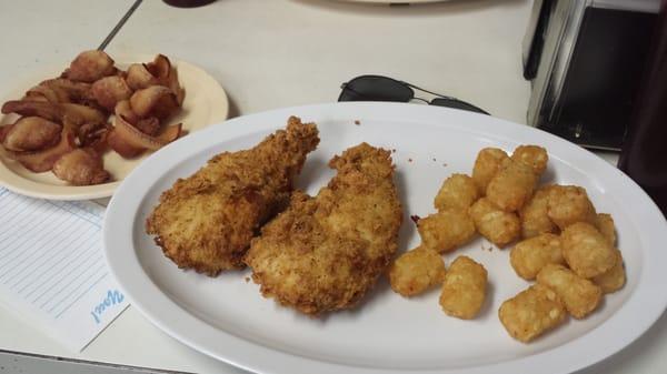 Chicken strip platter with tater tots and a side of pork jowl.