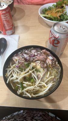 Steak, rice noodle ramen bowl with onions, garlic and bean sprouts