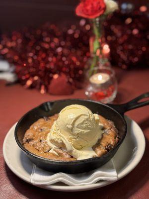 Skillet Cookie: freshly baked chocolate chip cookie topped with vanilla ice cream