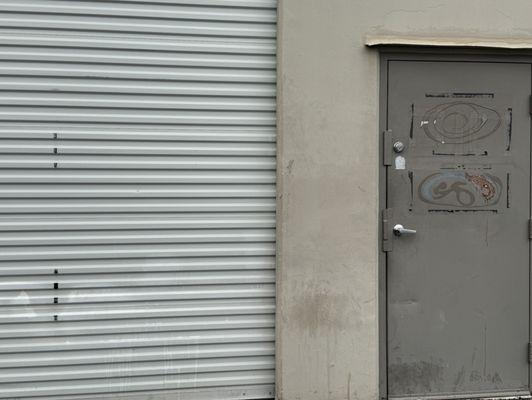 Signage For Galaxy Concrete Coatings Removed From Warehouse Doors.