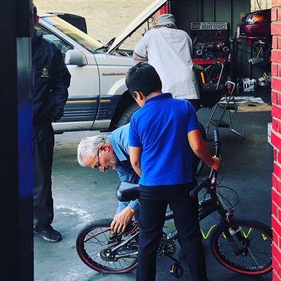 As you can see in the photo, Armen will help ANYONE, even a kid whose bicycle's tires are low on air.