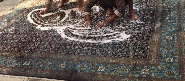 Rug cleaning by hand washing your rugs with a lot of soap and a lot of water!